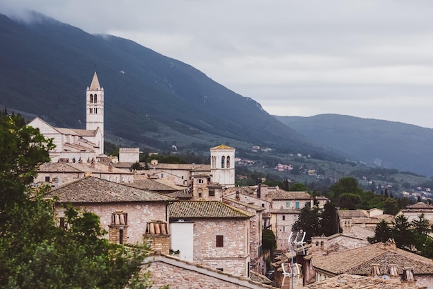 A view of a village with a church tower in the foreground