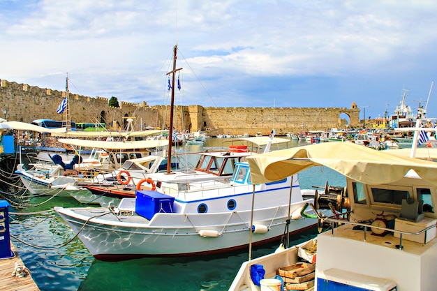 View vof Rhodes harbour, Greece. Motor boats and the ancient city wall