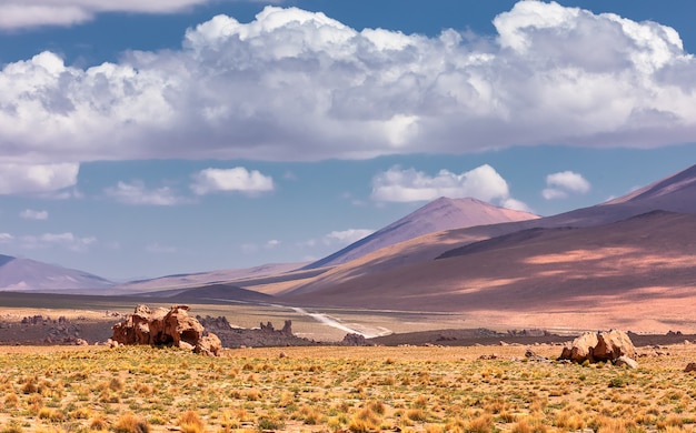 View on the volcano and old lava with dramatic clouds. Potosi. Bolivia. South America