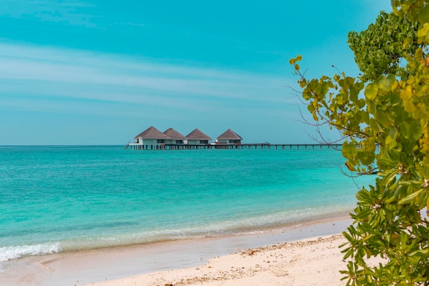 View of the water villas at sunrise in the Maldives the concept of luxury travel