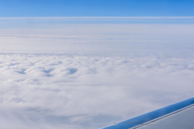 View on white clouds from the airplane window