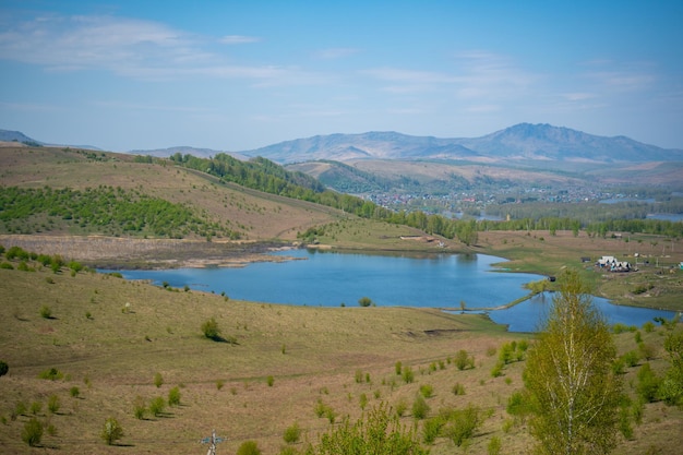 View with mountains lake and valley from top of the rock damn finger in the mountainous altai russia