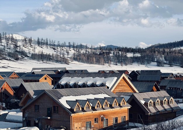 A view of a wooden building with snow on the roof