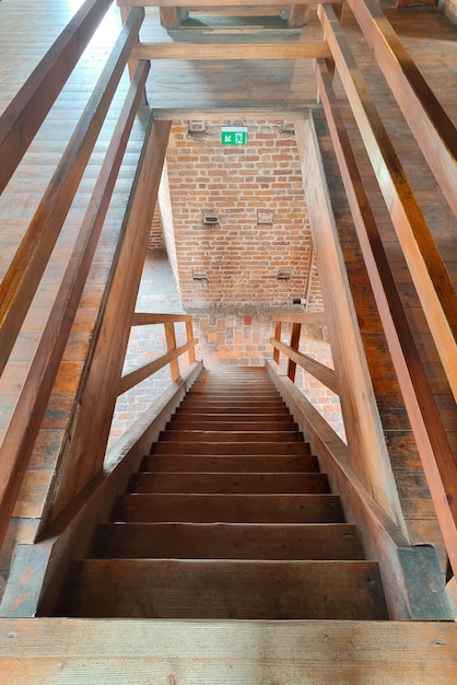 View of the wooden staircase in the building Wood background