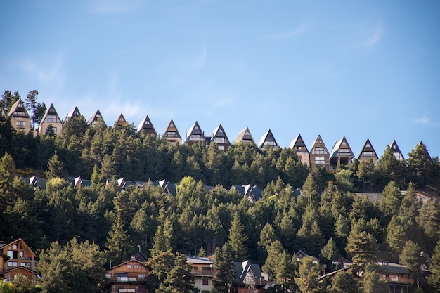 View of the wooden triangular houses in the small mountain village of Les Angles France