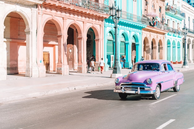 View of yellow classic vintage car in Old Havana, Cuba