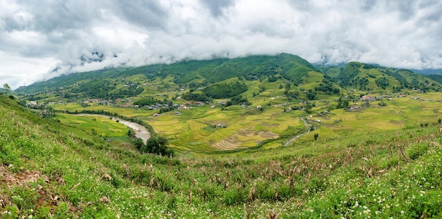 Viewpoint panorama of tribe village and river in valley at Sapa