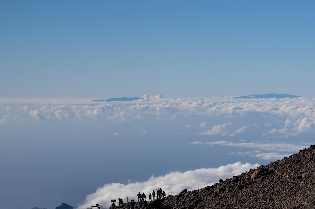 Viewpoint on the top of the mountain with blue sky clouds and mountains at the background