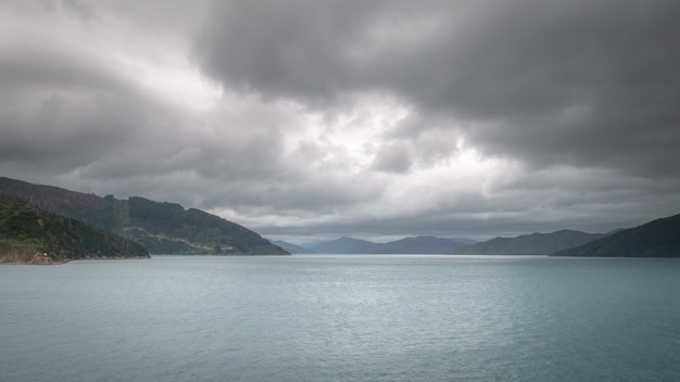 Views on ocean strait during overcast day