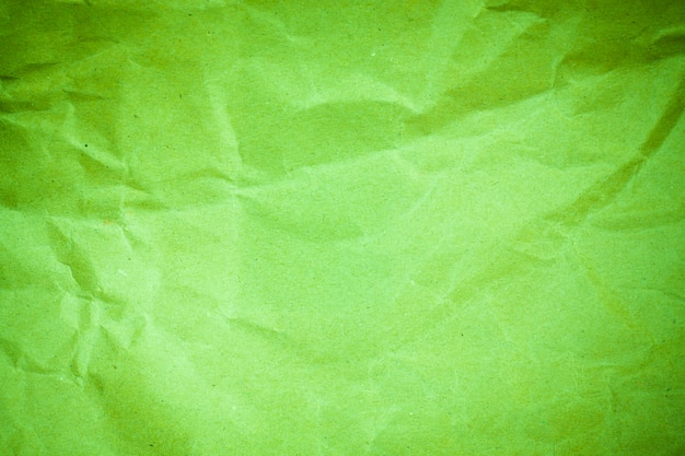 Vignette green crumpled paper.