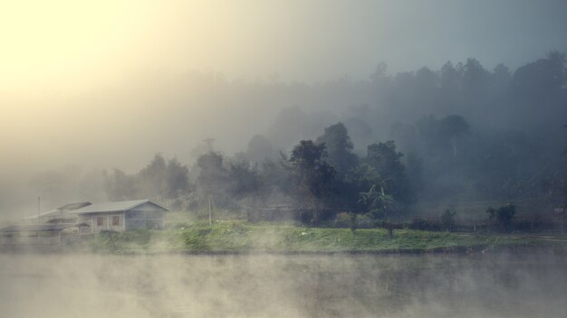 village among mountain and fog