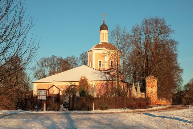 Village Vasilyevskoye, Russia - December 06, 2020: Orthodox Church of Resurrection of Word Living on nature winter table