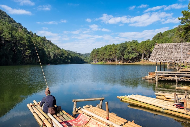 Villager fishing on reservoir in sunny at pang oung