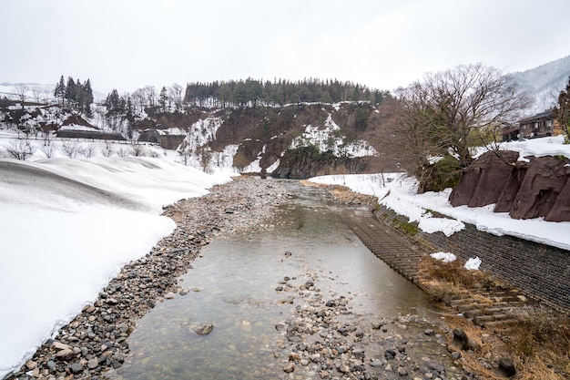 Villages of Shirakawago and Gokayama are one of Japan's UNESCO World Heritage Sites. Farm house in the village and mountain behind.