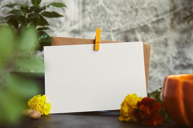 Vintage aesthetic autumn mock up Crafting empty postcard stationery card mockup among flowers and leaves Sustainable ecofriendly lifestyle background with blurred foreground