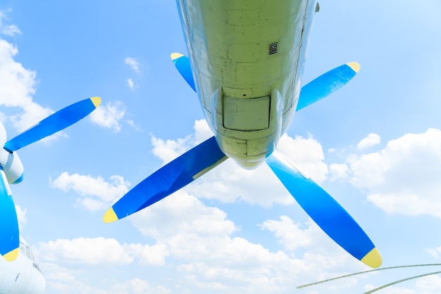 Vintage airplane propeller on blue sky background