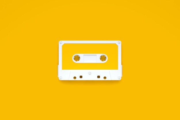 Vintage audio tape cassette on a yellow background Top view with copy space 3D render illustration