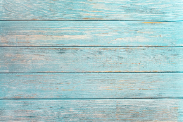 Vintage beach wood background - Old weathered wooden plank painted in turquoise or blue sea color.