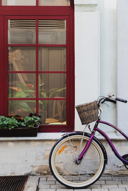 Vintage bicycle parked near old house in little European town