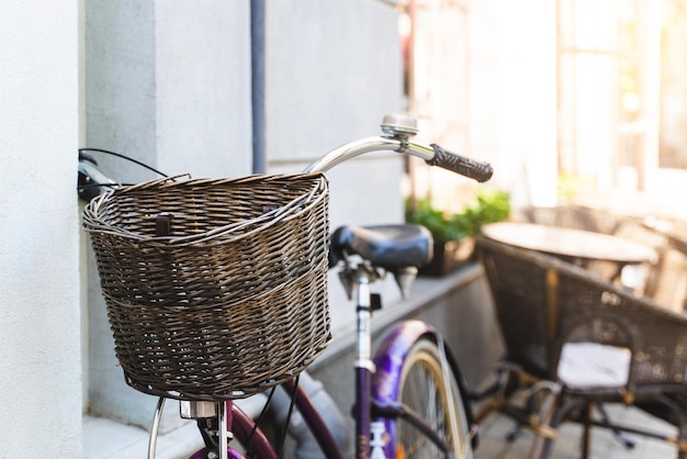 Vintage bicycle with wicker basket on the handlebar