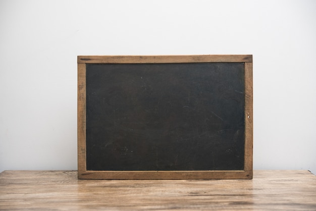 vintage blackboard with wooden frame on white 