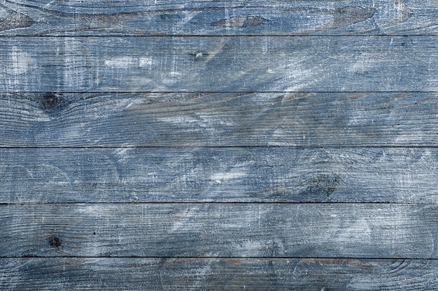 Vintage blue wood background texture with knots and nail holes