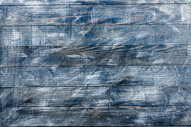 Vintage blue wood background texture with knots and nail holes