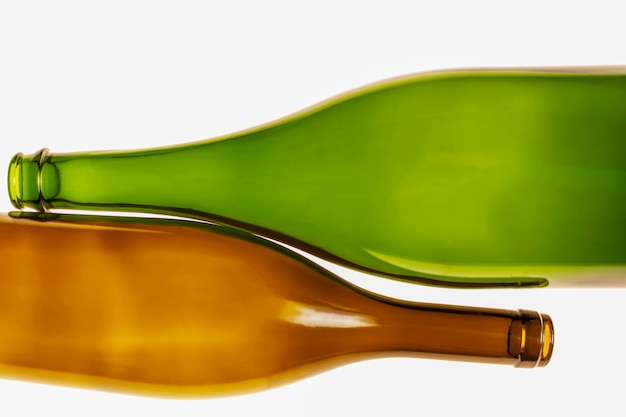 Vintage bottles of green and brown colors on a white