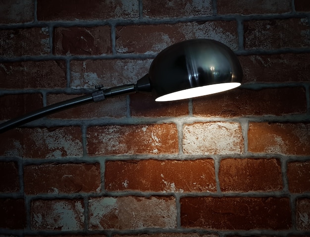 Vintage brick wall and vintage lamp with ray light