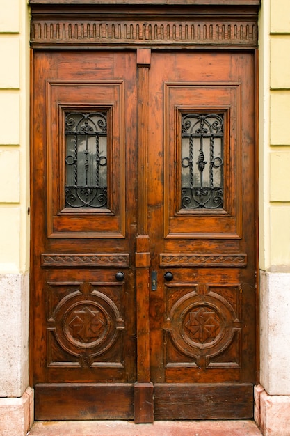 Vintage brown wooden door outdoors in Europe