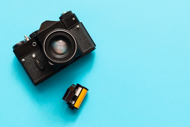 Vintage camera on a blue background