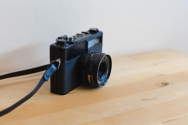 Vintage camera on a wooden table