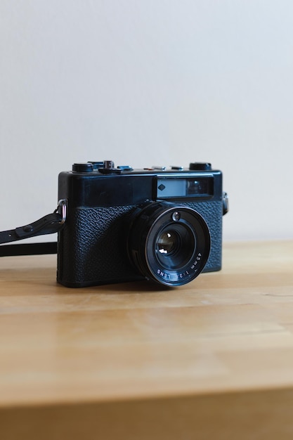 Vintage camera on a wooden table