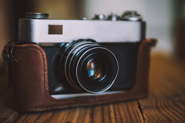 Vintage camera on wooden table