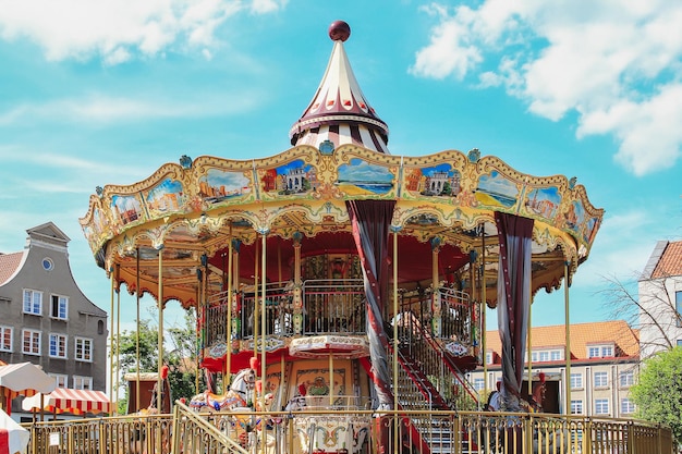 Vintage Carousel In Gdansk Poland With A Blue Sky In The Background