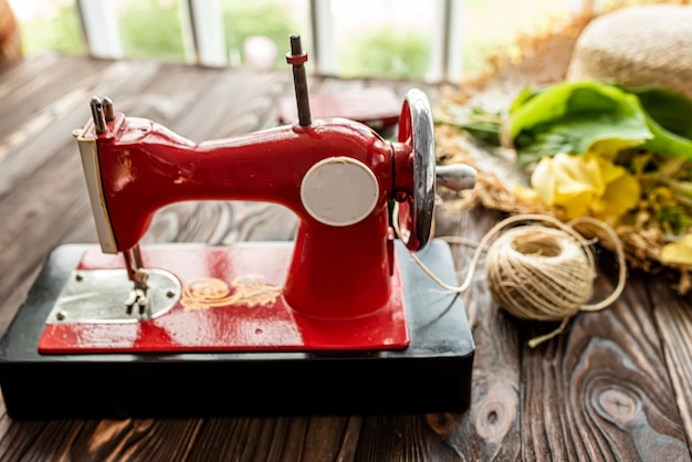 Vintage childrens sewing machine on a wooden table  Childrens Soviet sewing machine toy