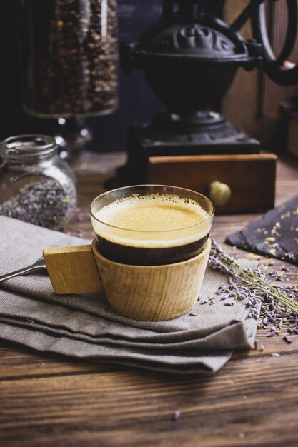 vintage coffee grinder coffee and croissant on a dark background