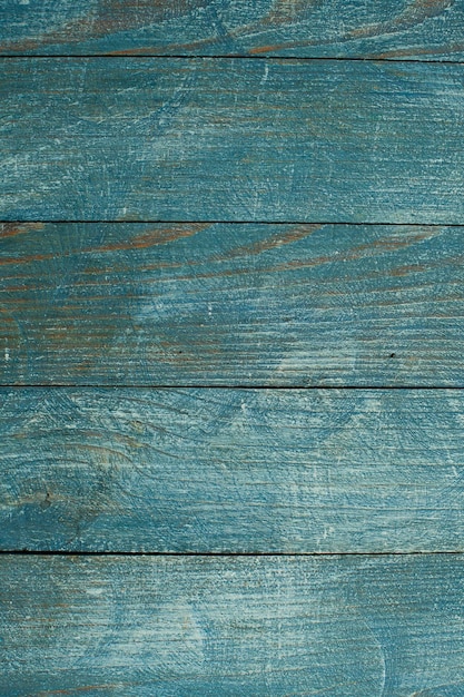 Vintage colored wood background texture with knots and nail holes.