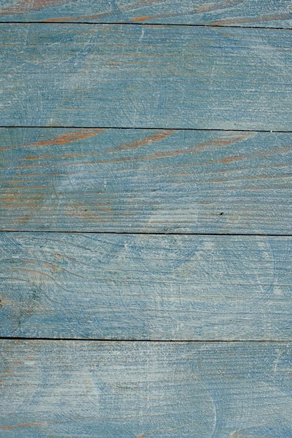 Vintage colored wood background texture with knots and nail holes.