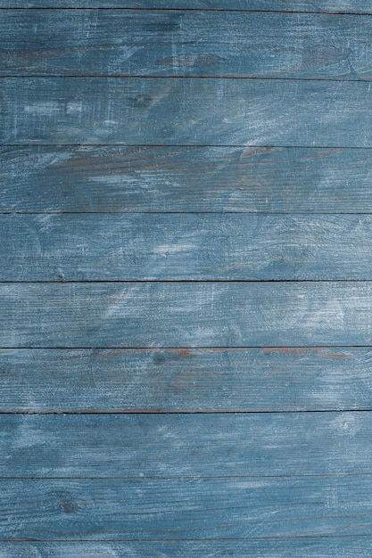 Vintage colored wood background texture with knots and nail holes.