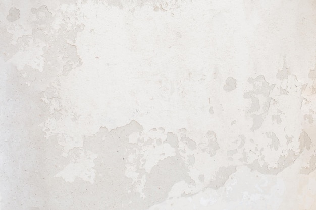 Vintage concrete texture with cracks and scratches White wall