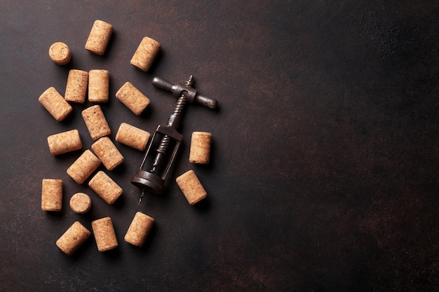 Vintage corkscrew and wine corks