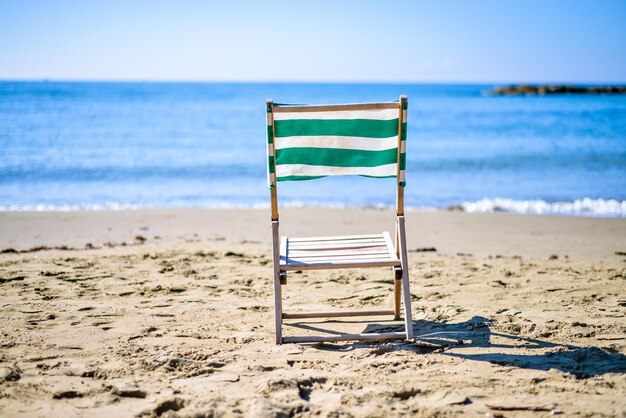 vintage deck chair on the sea sunset beach