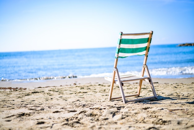 vintage deck chair on the sea sunset beach