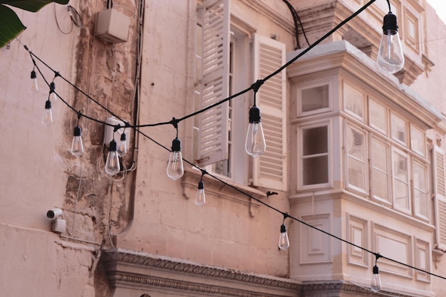 Vintage details on the facade of old maltese house downtown in Valetta Malta