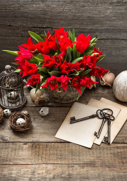 Vintage easter decoration with eggs and red tulip flowers