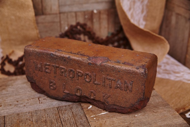 Vintage Embossed Metropolitan Block on Rustic Backdrop