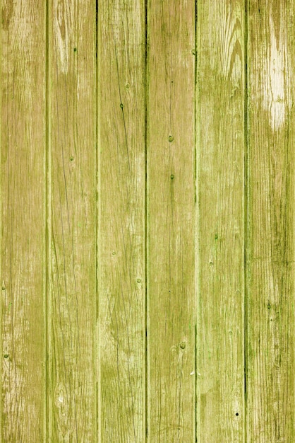 Vintage fence of old wooden boards Texture of an aging wooden surface Beautiful wooden background