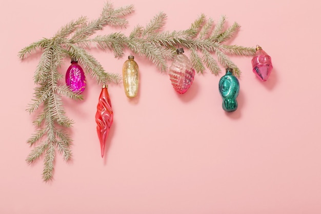 Vintage glass christmas toys on pink background