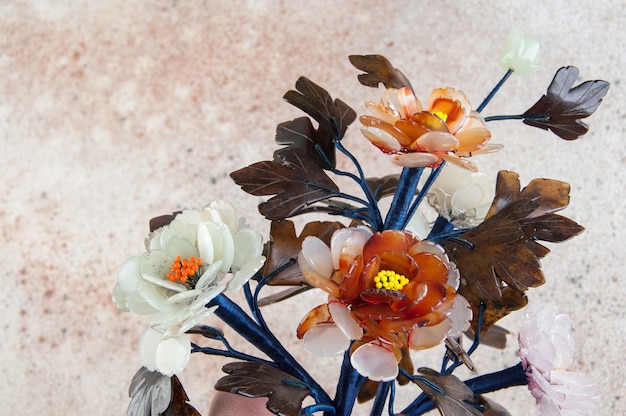 Vintage glass flowers on concrete.